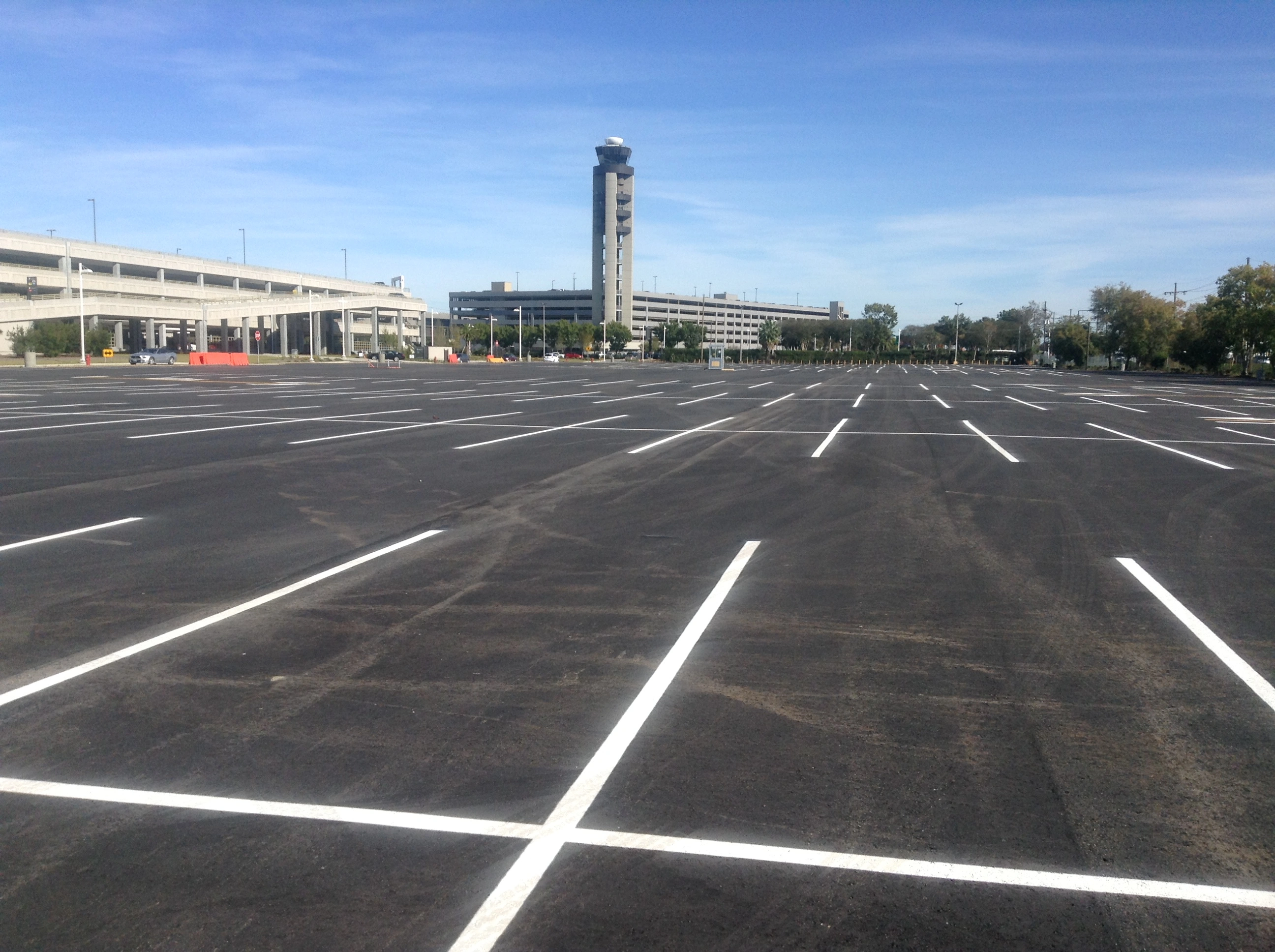 New parking lot design New Orleans — freshly striped MSY airport parking lot